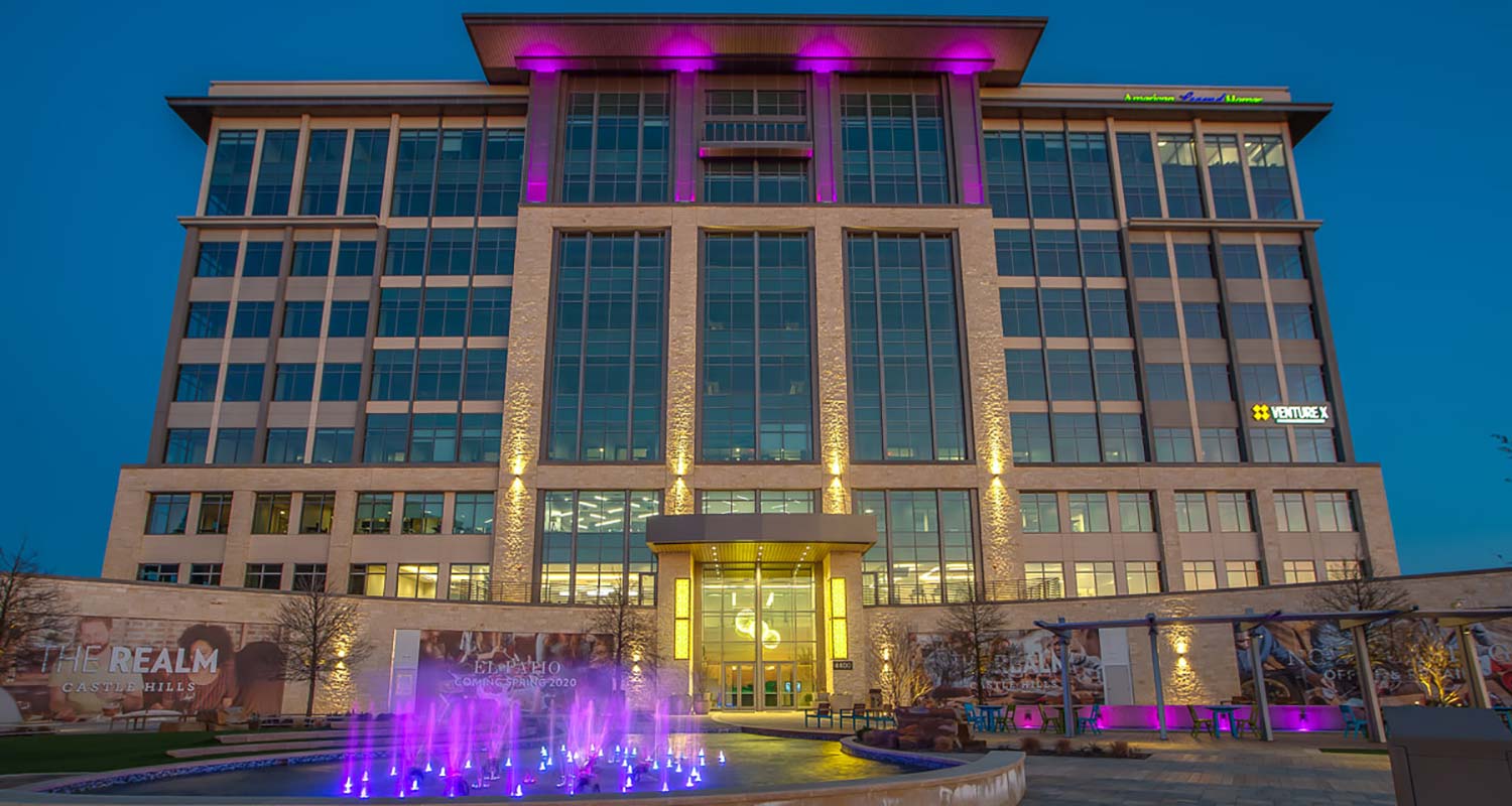 Image of the Offices at The Realm as seen at night.